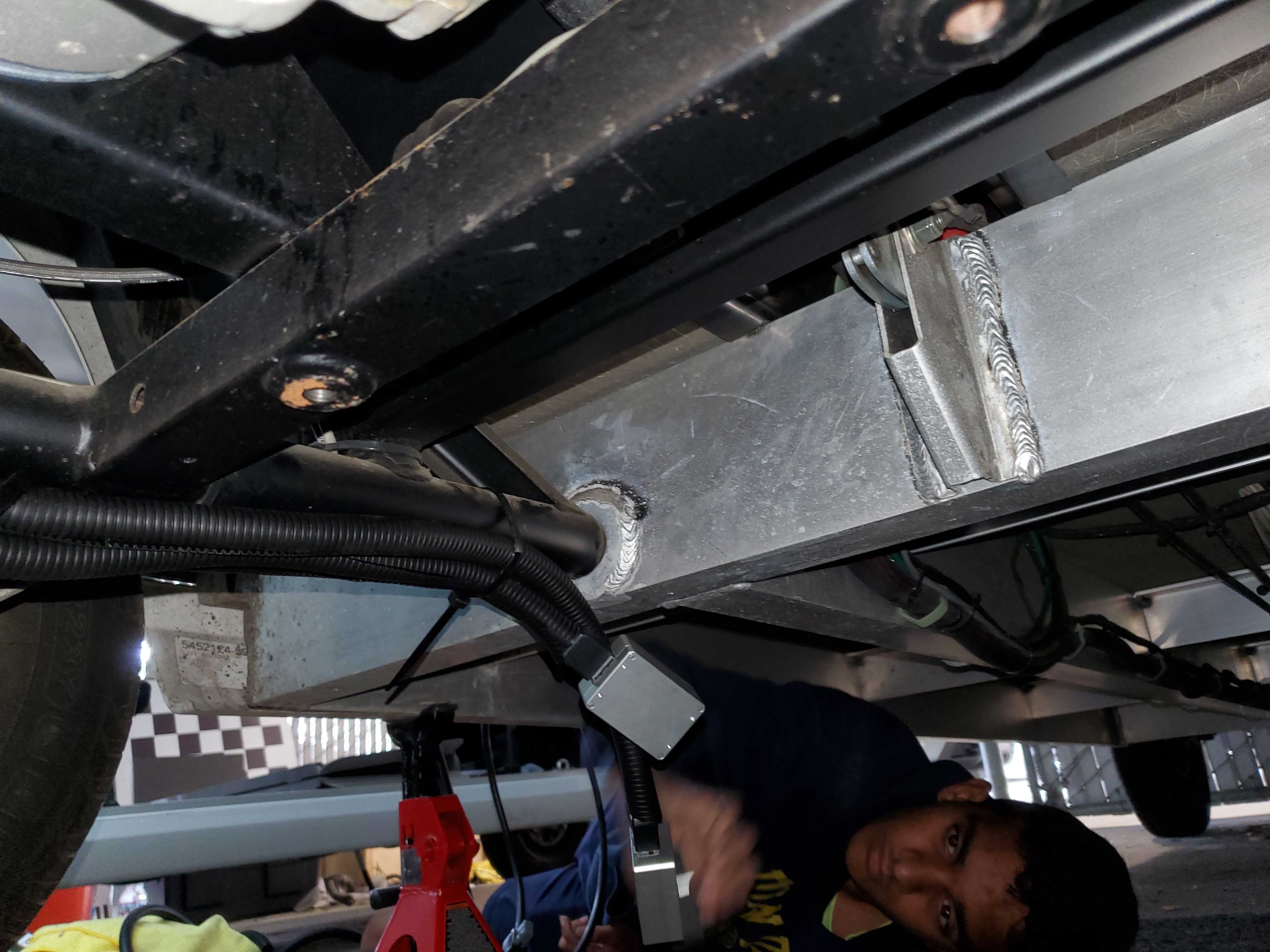 Working underneath an autonomous golf cart at a UCSD research internship!