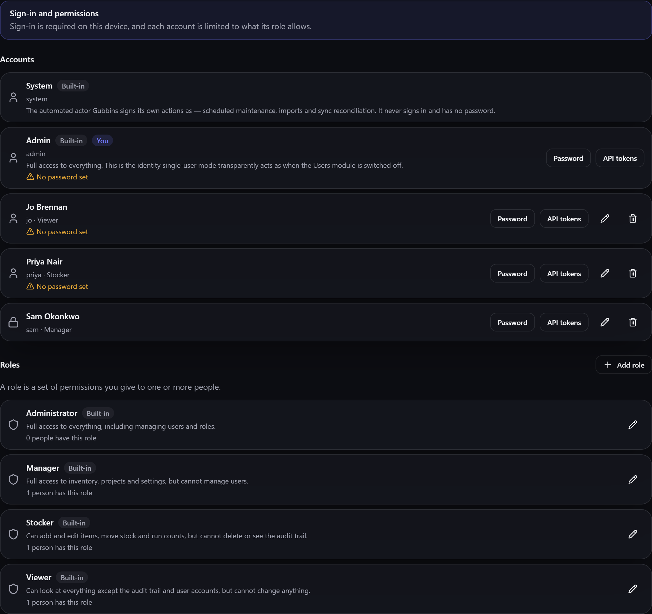 The Users screen, listing accounts with their roles and a Roles section beneath
