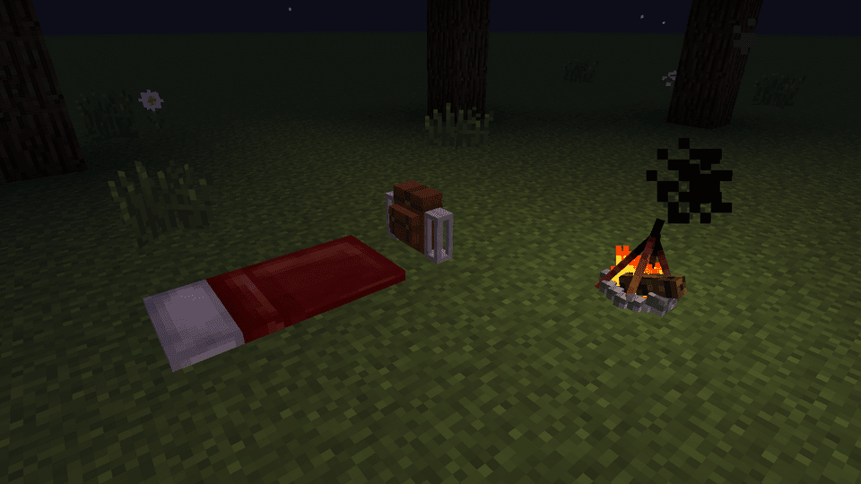 A placed backpack with the sleeping bag unrolled and a campfire next to it, at night