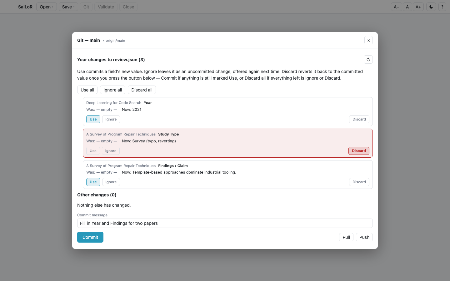 The Git panel's field-level review: three changed fields, each with Use/Ignore/Discard, and a commit message