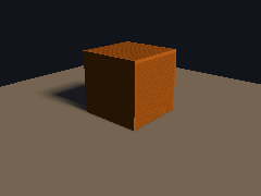A low sun walks around a cube and throws a long shadow