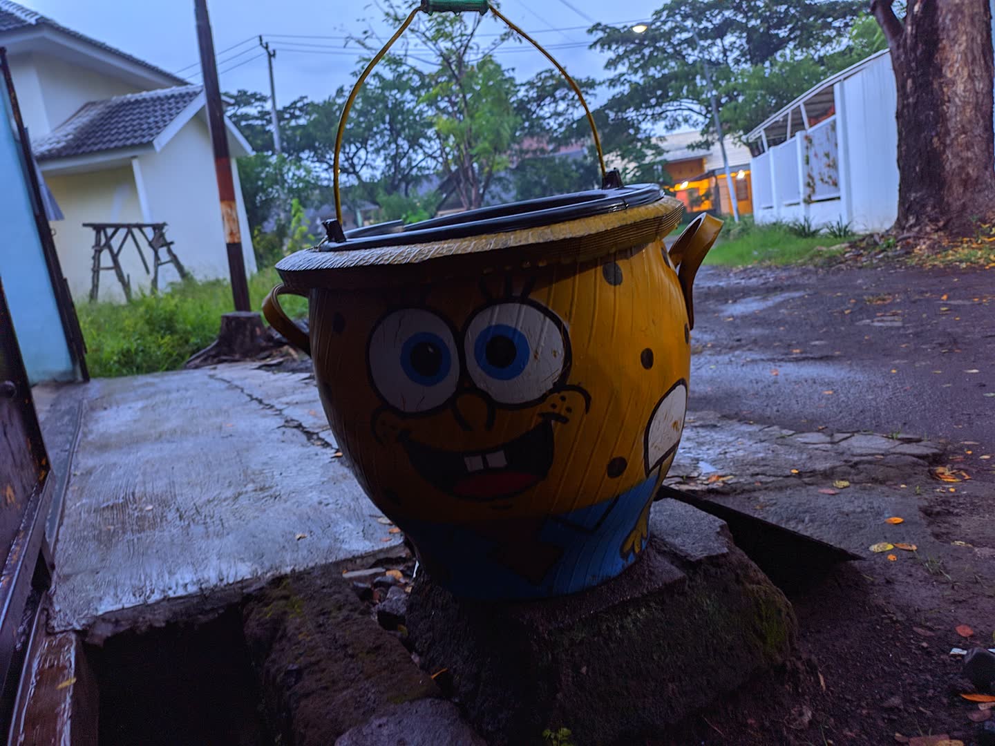 spongebob trash can on a cold and rainy evening