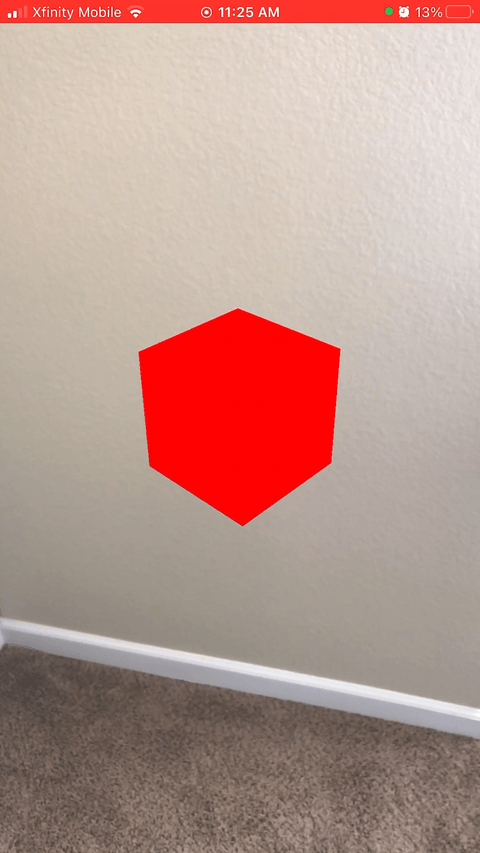 Gif of the code's result. Tapping the red cube turns it blue.