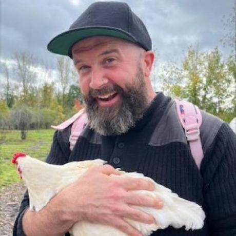 Jordan Conway holding a chicken