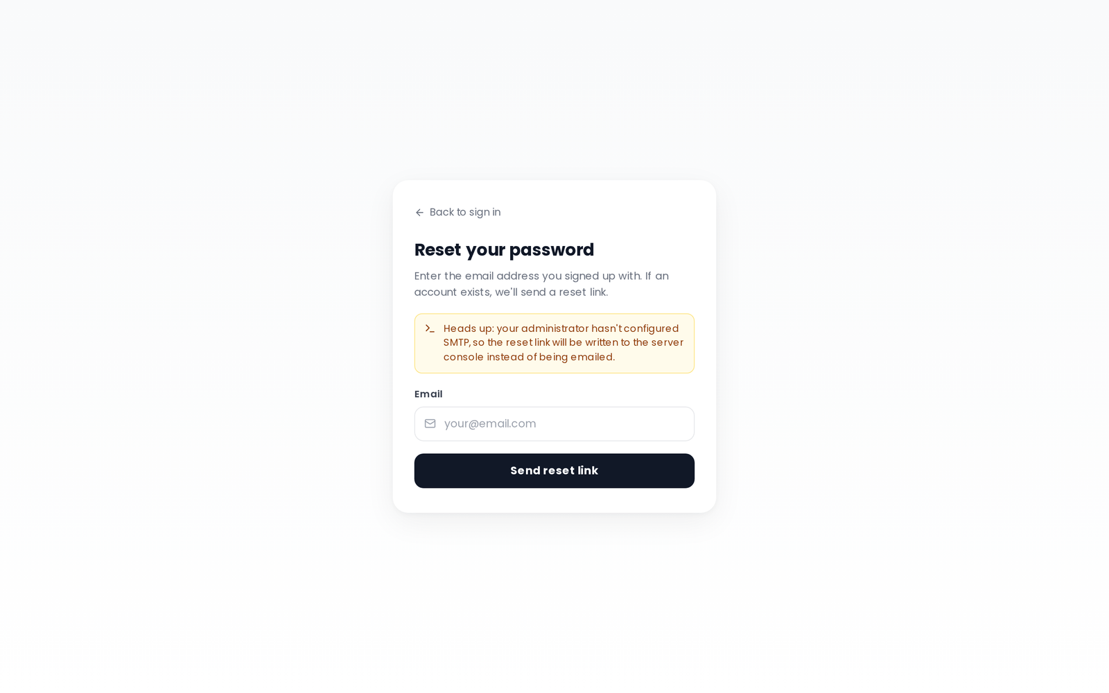 Reset your password card with a Back to sign in link, an email field and a Send reset link button, plus a warning that SMTP is unconfigured so the reset link is written to the server console