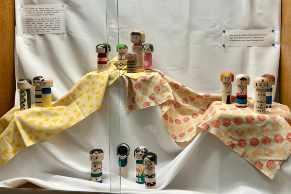 kokeshi dolls in display case