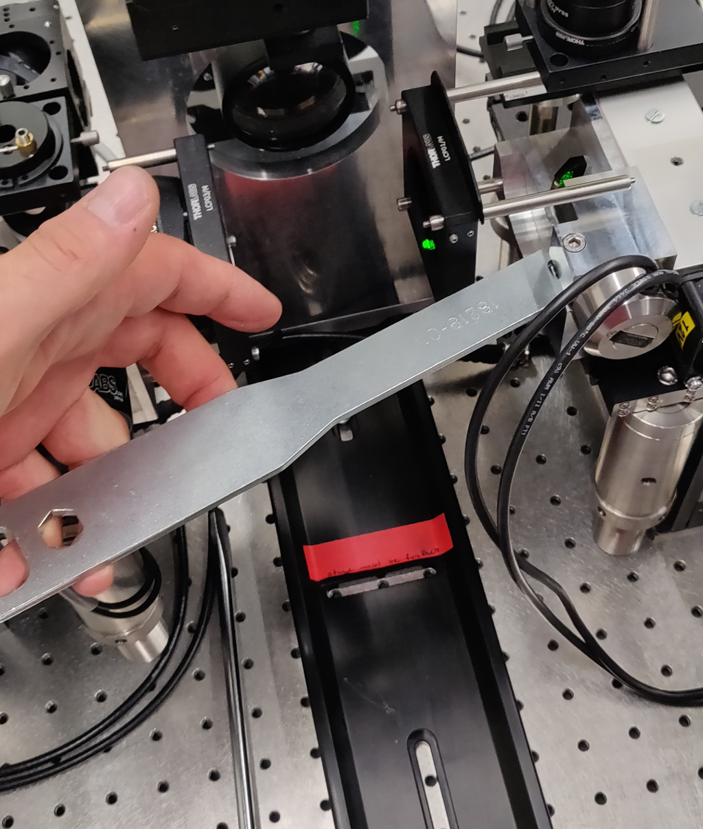 Using a wrench to rotate the scanner