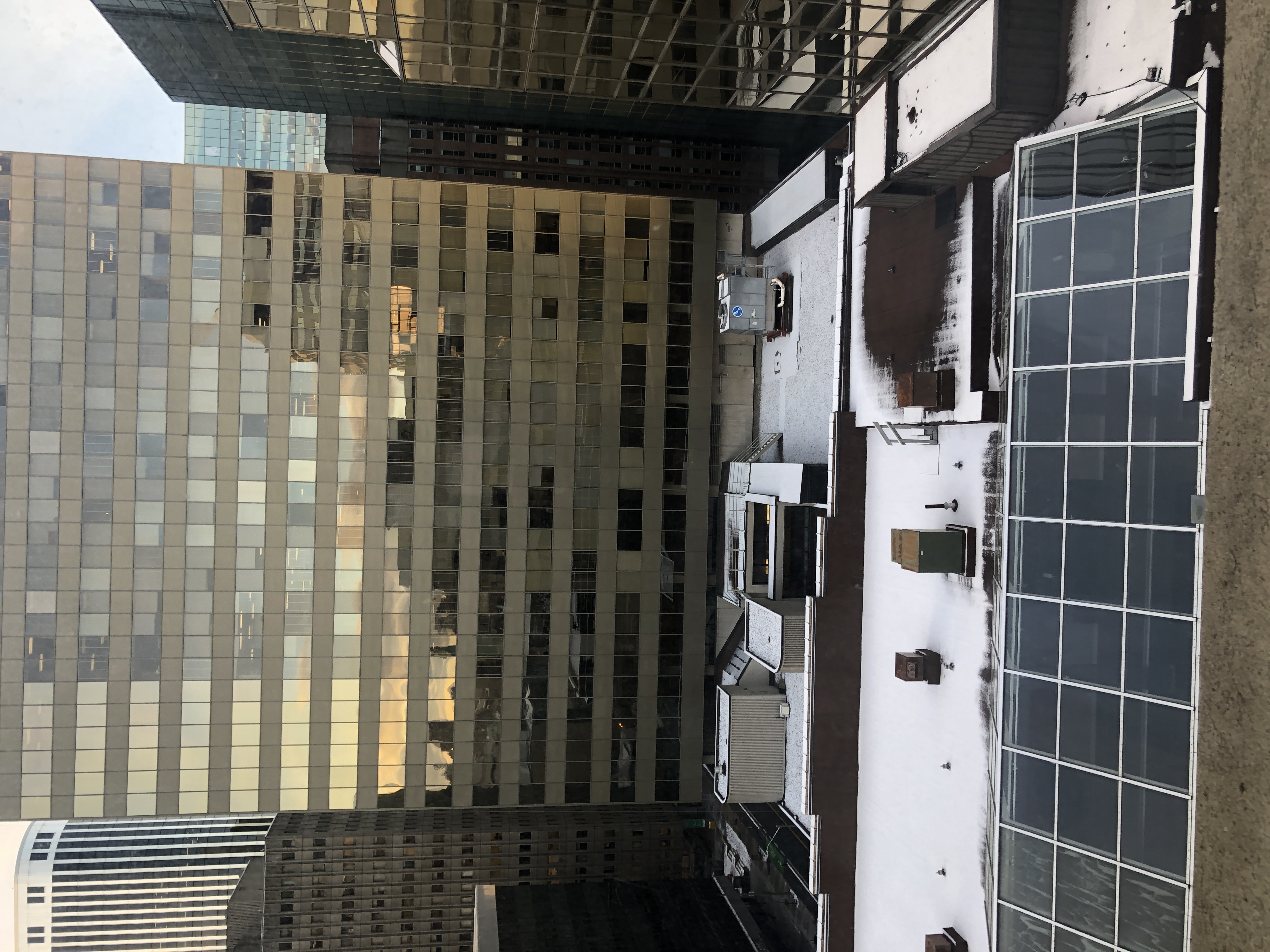 a building rooftop covered in snow