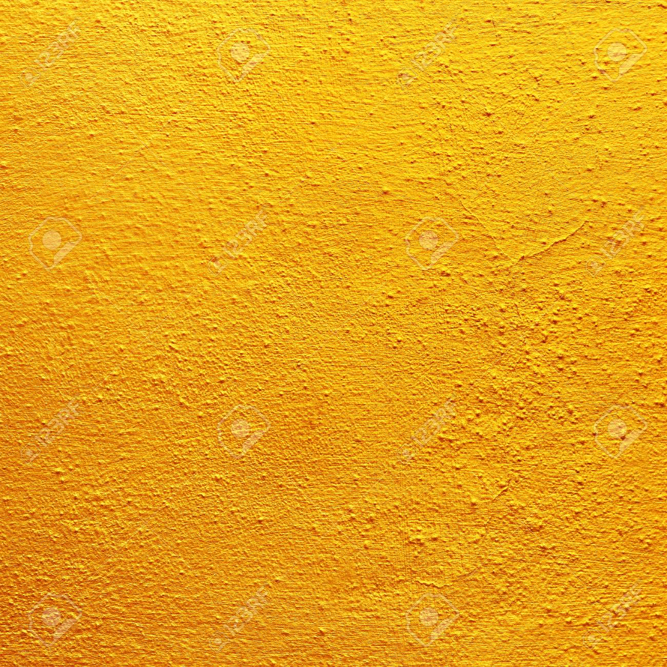88285985-gold-or-yellow-paint-on-rough-cement-wall-texture.jpg