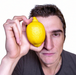 Model1_a_photorealistic_image_of_a_man_holding_a_lemon_near_his_face_04062022.png