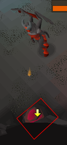 A glowing rock attacked by Zalcano with a tile highlight