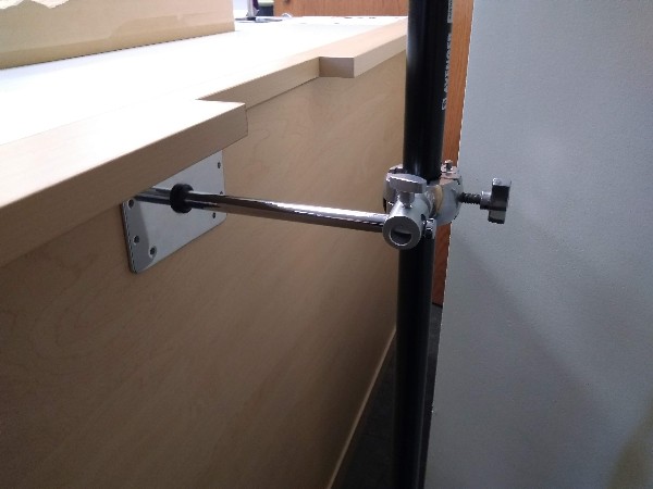 3-way clamp system holding a wall plate