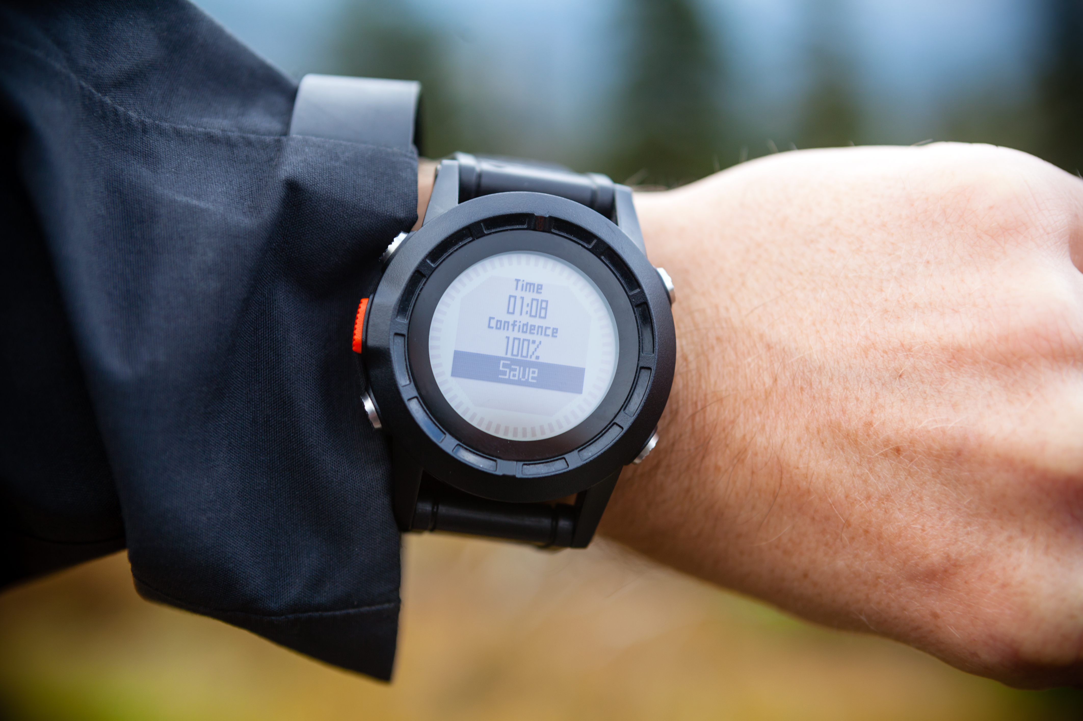hiker-on-mountain-trail-checking-compass-wearable--PXCSLN7.jpg